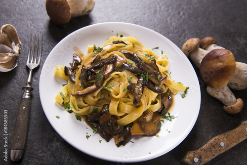 Tagiatelle pasta with creamy sauce with porcini mushrooms