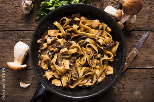 Tagiatelle pasta with creamy sauce with porcini mushrooms