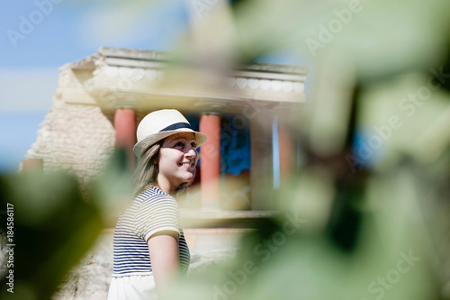 woman smiling in front of temple