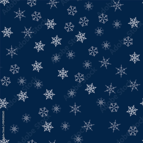 Christmas seamless pattern from snowflakes. New year festive texture for design postcards, invitations, greetings, and clothing.