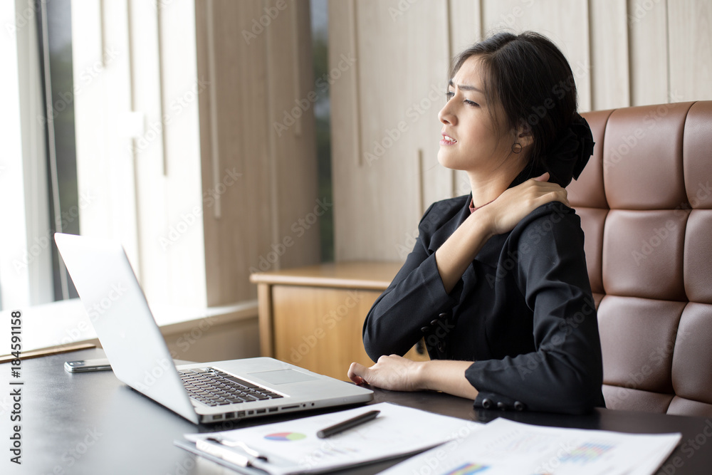 Asian woman working hard and feeling dizzy at office, woman with office syndrome concept. Asian woman working hard and feeling dizzy at office, woman with office syndrome concept.