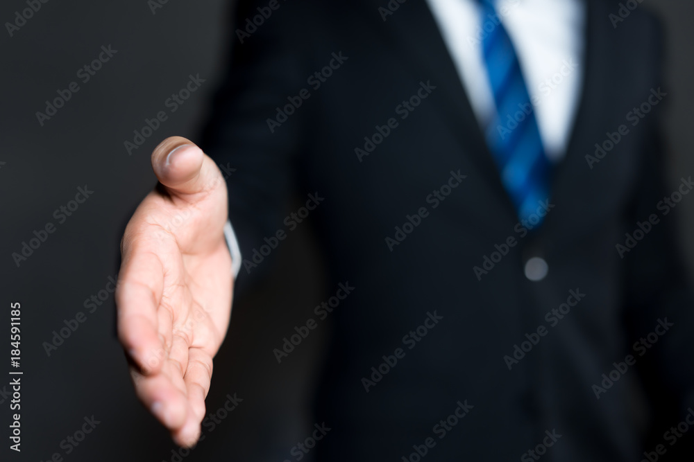 Obraz premium Business man open hand ready to seal a deal, partner shaking hands