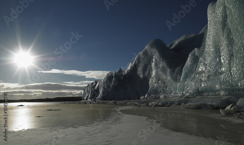 Fjallsjokull glacier lit by sun photo