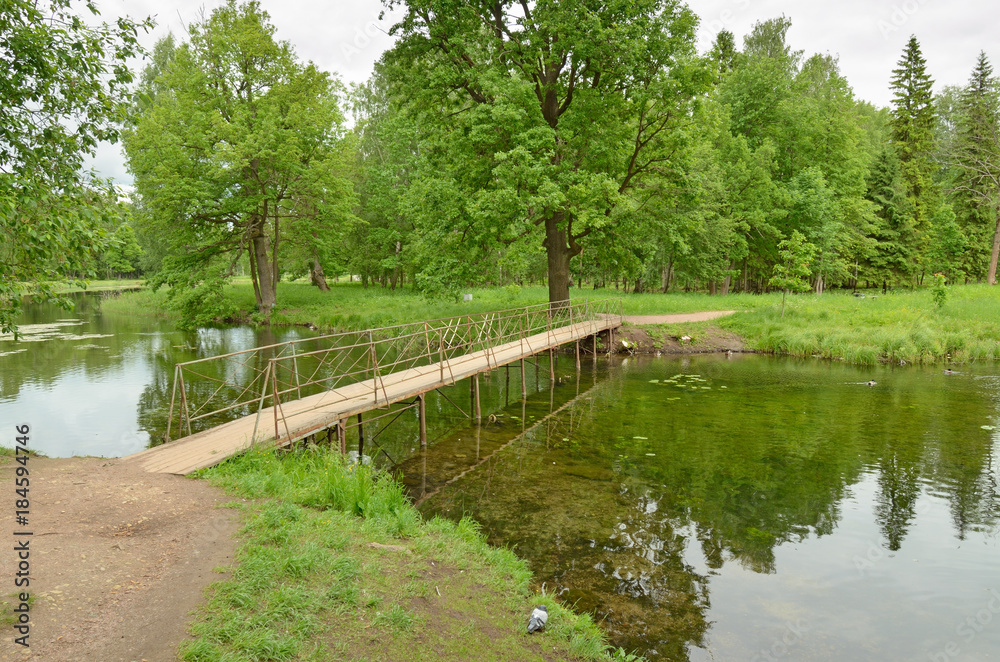 Fototapeta premium Wooden bridge across the river.