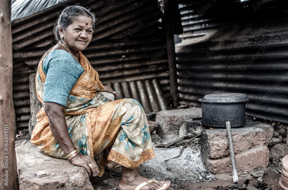 Old Woman and a Traditional Stove