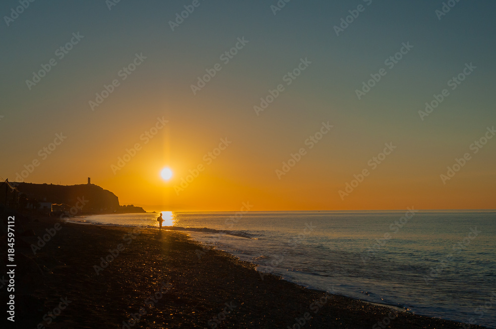Angler, Fisherman in morning sun, sunrise in Albufeira, portugal