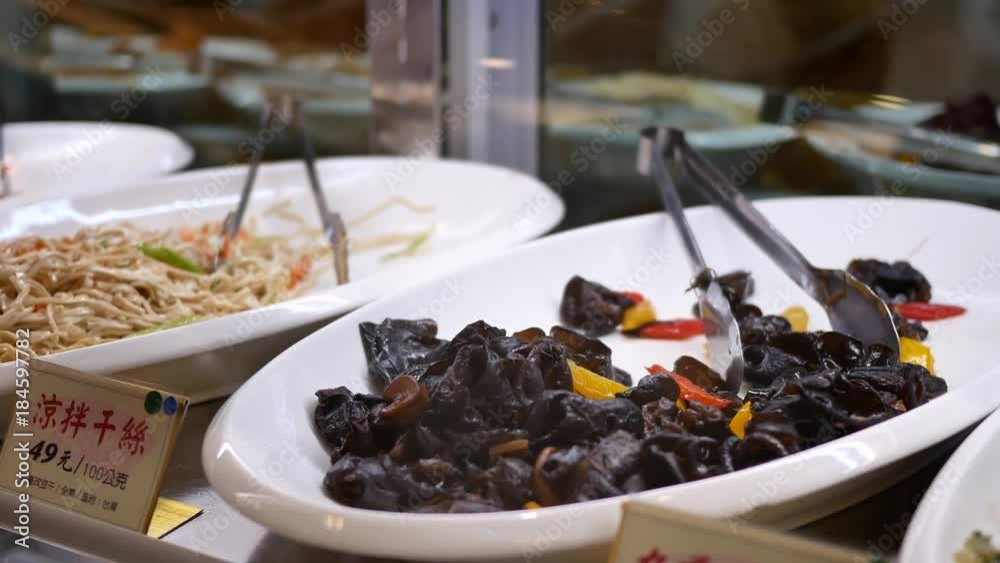 Motion of worker packing appetizers for customer at food court area with 4k resolution. Motion of worker packing appetizers for customer at food court area with 4k resolution.