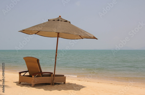 the loungers on the beach of a tropical island © Nina