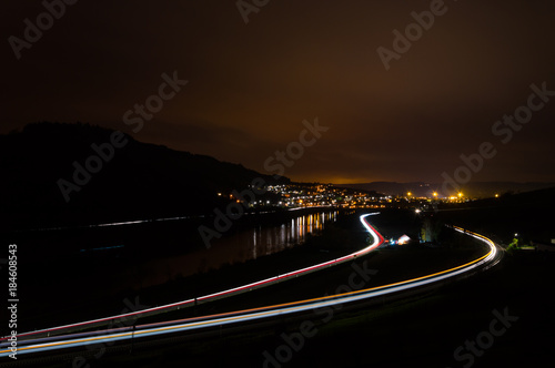 street train and river at night