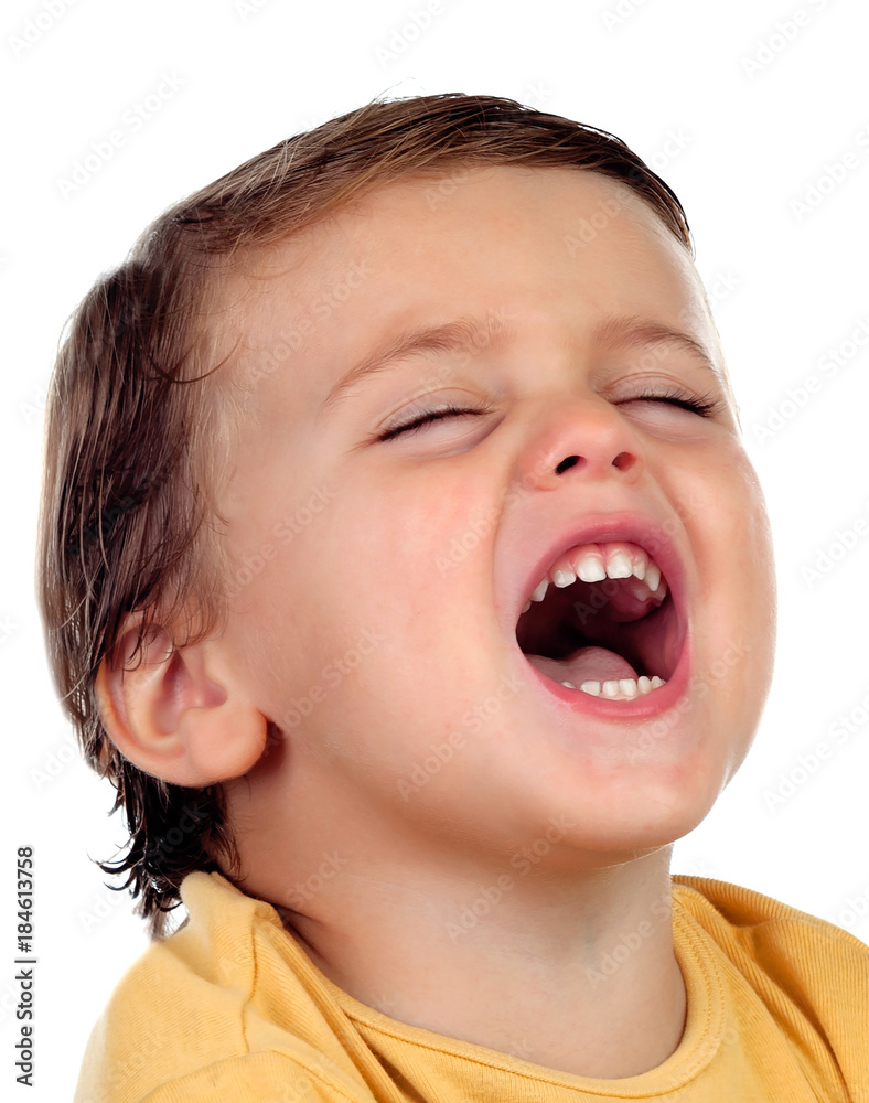 Adorable small child two years old with yellow t-shirt opening his mouth Adorable small child two years old with yellow t-shirt opening his mouth