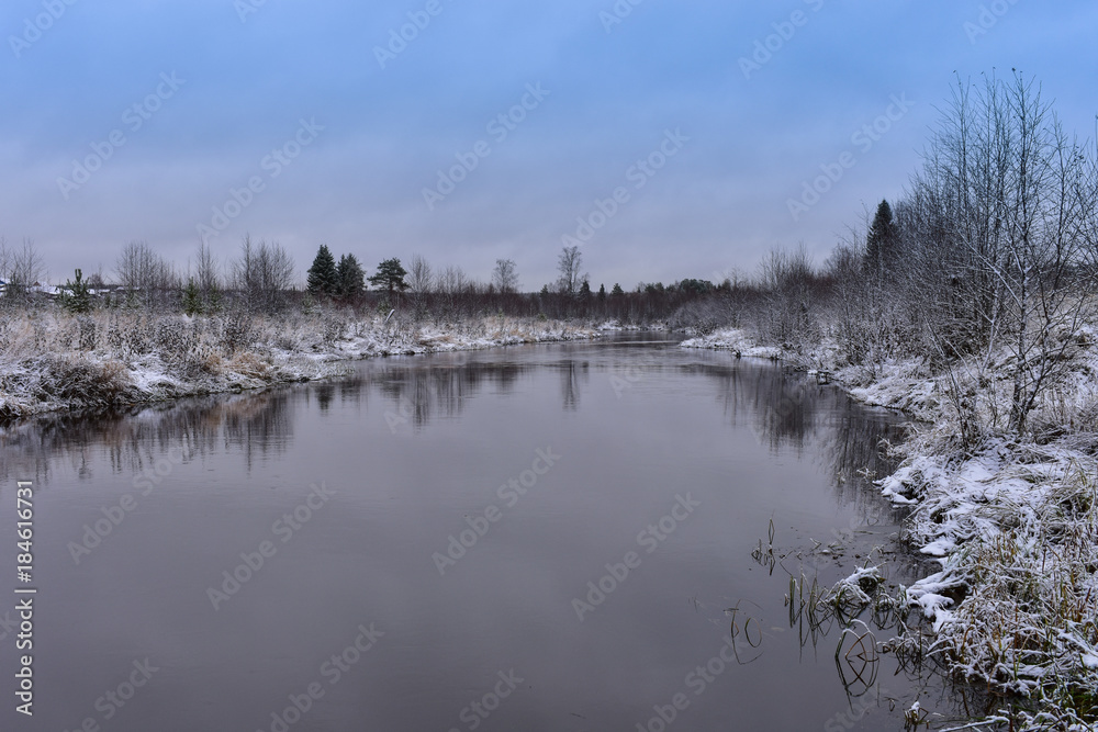 Snowy banks of the river in early December, snow, cold