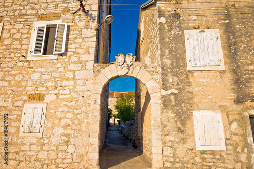 Mediterranean village of Zlarin stone architecture and gate view