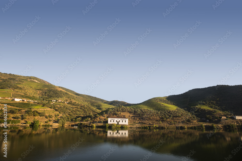 a house reflecting on the douro river, portugal
