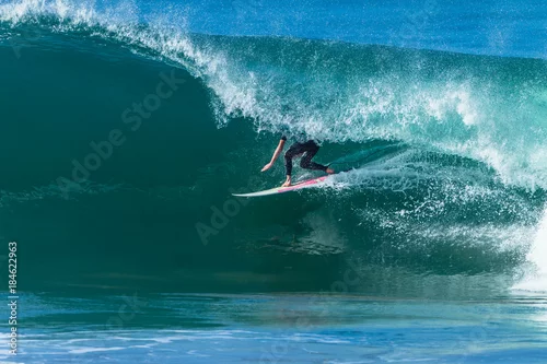 Obraz Surfing Surfer Inside Hollow Ocean Wave Tube Ride.