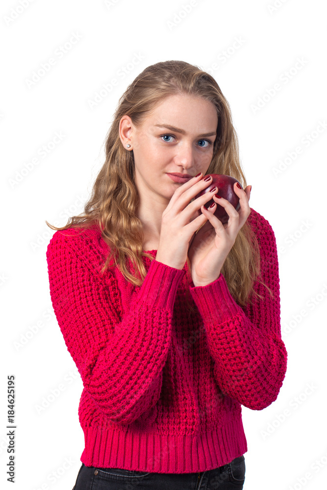 Pretty blonde girl with red apple in her hand, white background