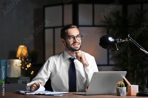 Young man working in office...