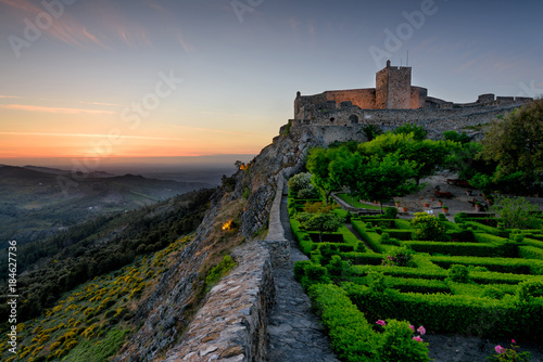 Amazing Sunset at Castle Marvao, a small picturesque village in the Alentejo. Panoramic view landscape. Beautiful garden within the walls of the fortress photo