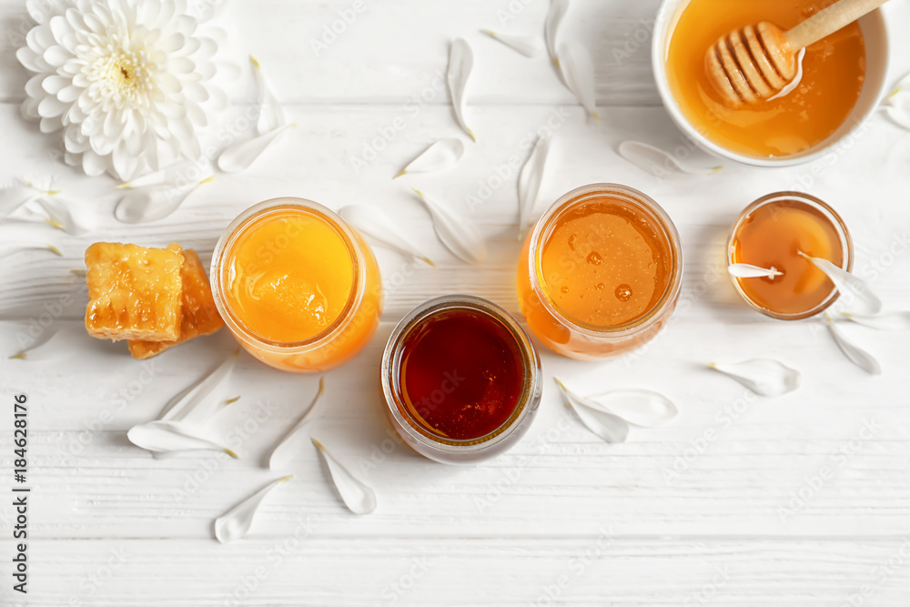 Composition with honey on white wooden background Composition with honey on white wooden background