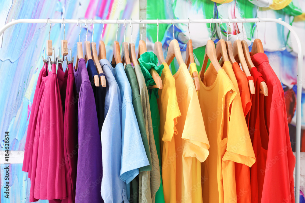 Rainbow clothes hanging on rack Rainbow clothes hanging on rack