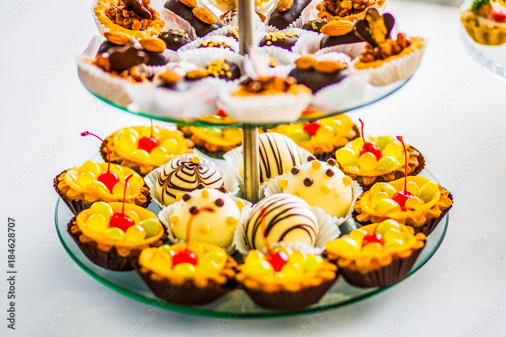 Yellow and chocolate cupcaces on a festive table