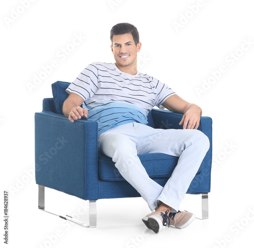 Handsome young man sitting ...