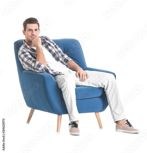 Handsome young man sitting ...