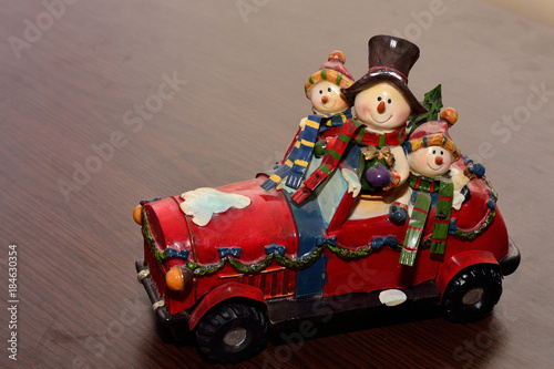 Red toy car with christmas theme 