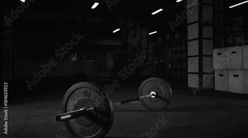Heavy barbell on the floor of a gym studio
