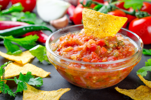 Traditional mexican homemade salsa sauce with ingredients, tomat