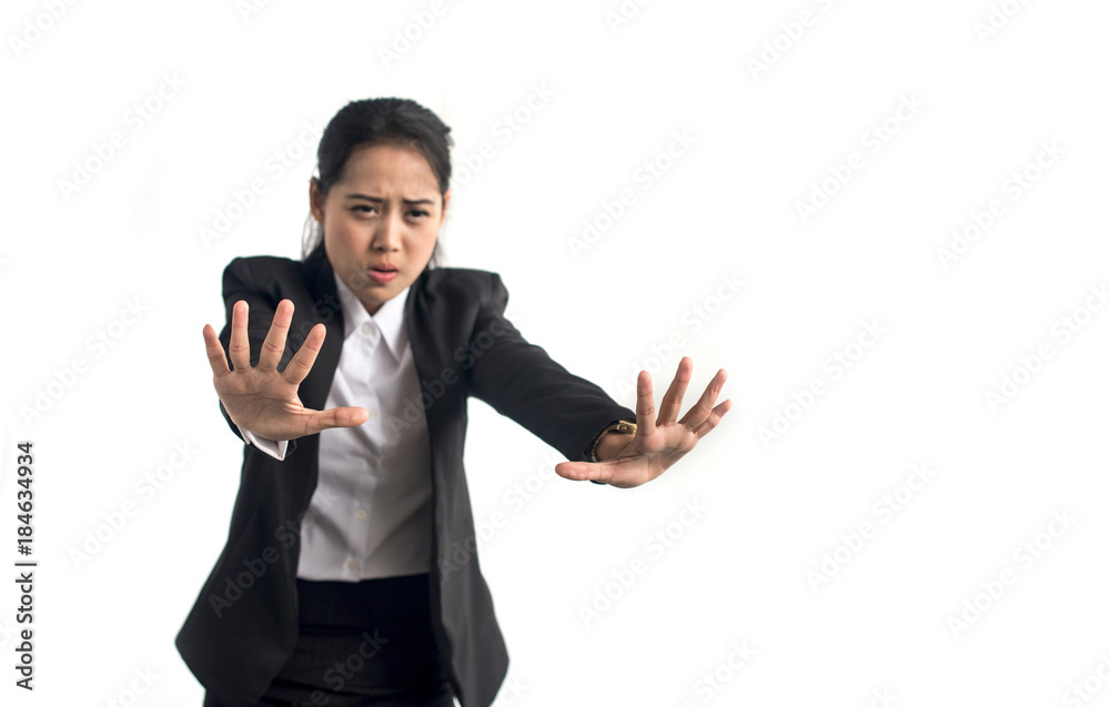 Scared businesswoman defending herself, isolated on white background Scared businesswoman defending herself, isolated on white background