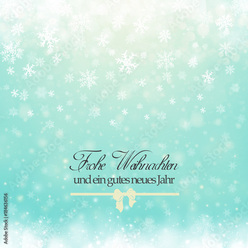 Christmas winter abstract background with snowflakes, bokeh lights and congratulations. Xmas New Year's wallpaper. Frohe Weihnachten Und Ein Gutes Neues Jahr