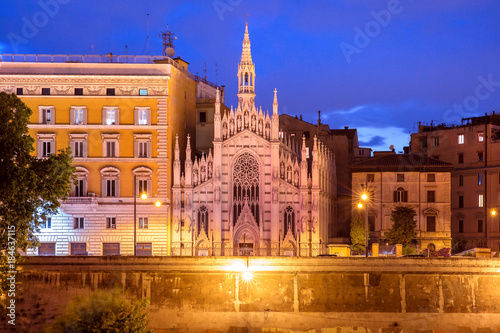 Tiber riverside with Church of the Sacred Heart of Jesus in Prati during evening blue hour in Rome, Italy