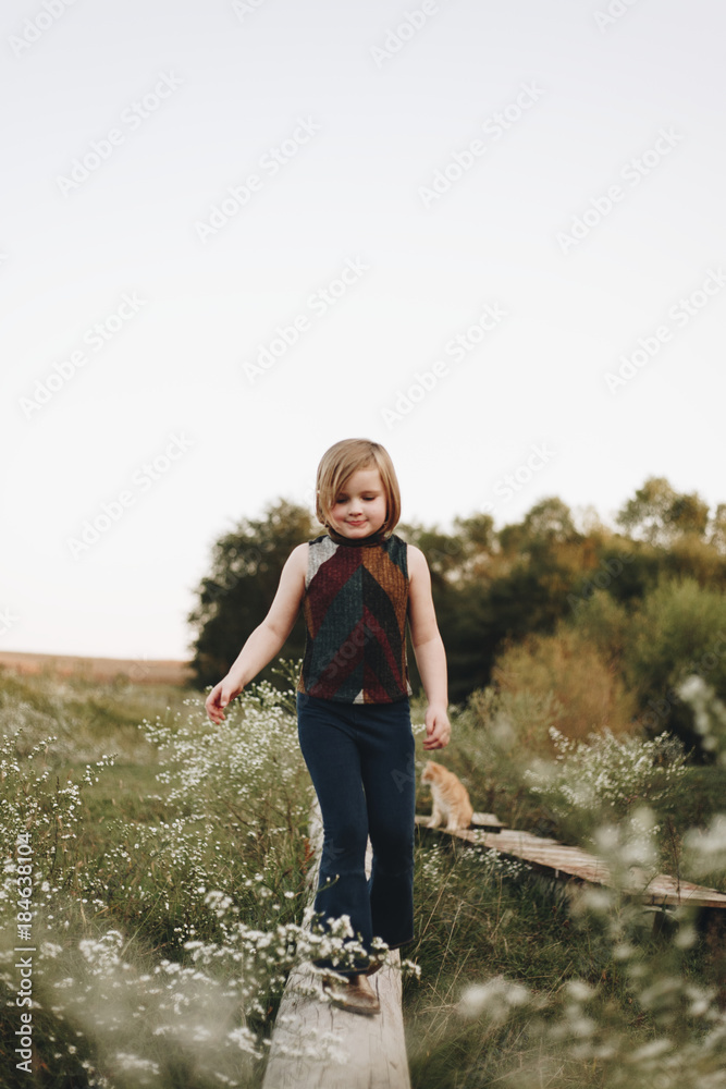 Little girl  having fun in a farm