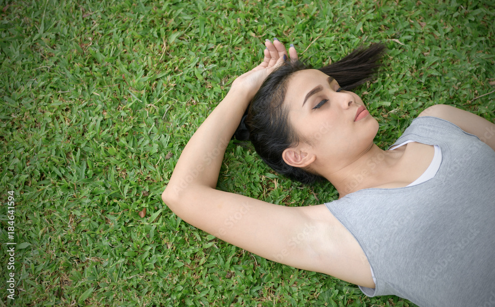 cute woman lying on the grass, relax and lifestyle cute woman lying on the grass, relax and lifestyle