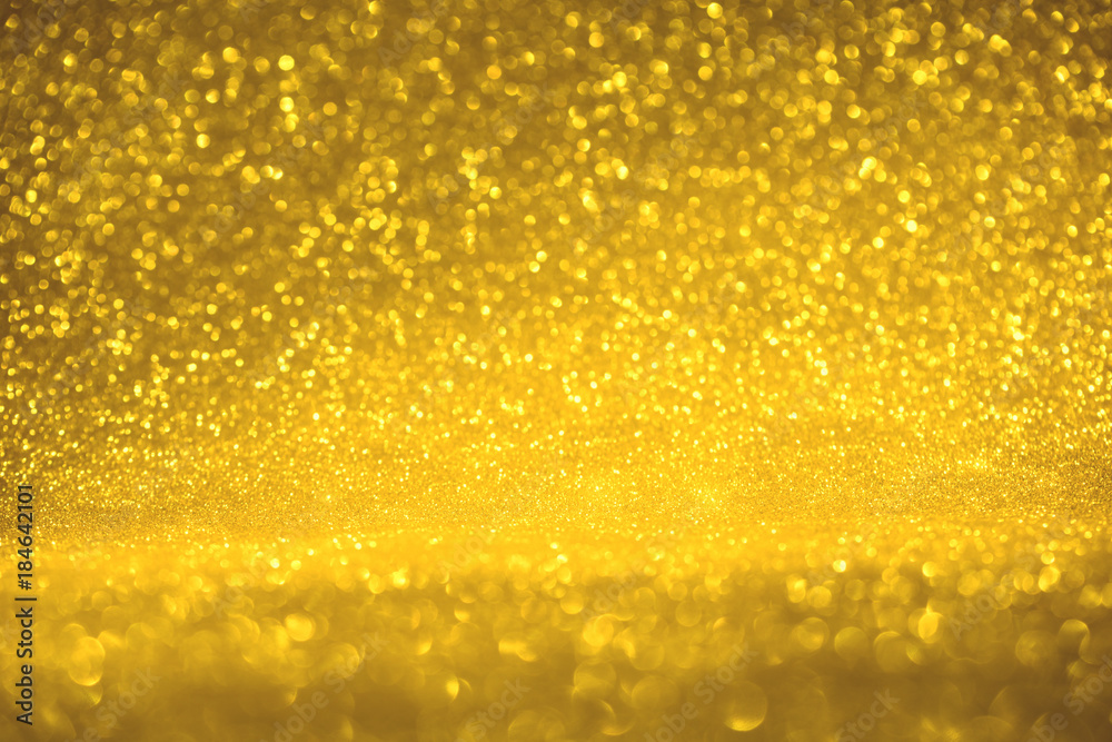 golden glitter texture Colorfull Blurred abstract background for birthday, anniversary, wedding, new year eve or Christmas.