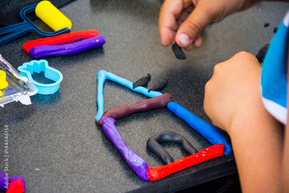 children playing with modeling clay