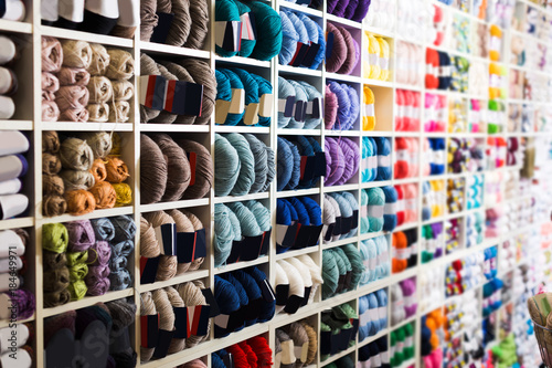 Shelves with colorful knitting yarn is staying