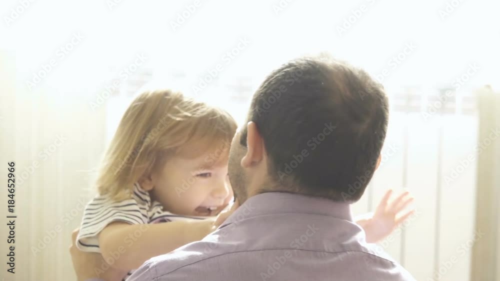 Little Son Rushes Into father Arms At Home. Slow motion. Big Hug. Family values. Kiss. Little Son Rushes Into father Arms At Home. Slow motion. Big Hug. Family values. Kiss.
