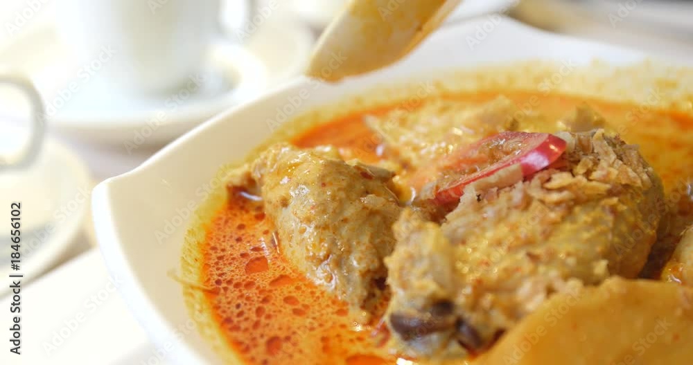 Eating spicy curry chicken Eating spicy curry chicken
