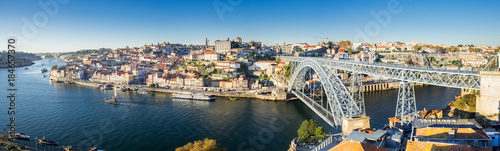 Very large panoramic view on Dom Luis I bridge and Douro River at sunset time. Porto. Portugal © vadiml