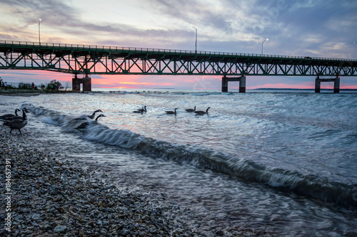 Under Mackinaw. Buried beneath the Straits of Mackinaw lies the controversial Pipeline Number 5. Opponents claim the aging oil line threatens the largest freshwater system in the world. photo