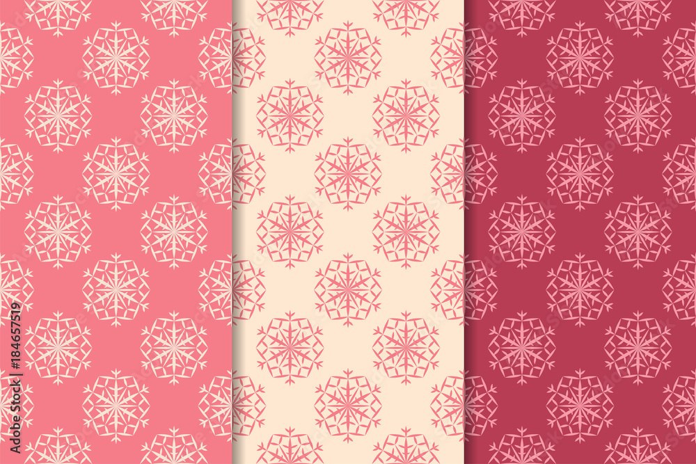 Snowflakes patterns. Set of cherry red seamless backgrounds with christmas elements Snowflakes patterns. Set of cherry red seamless backgrounds with christmas elements