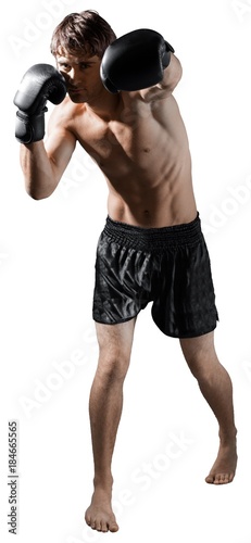 Male Boxer / Kickboxer Punching © BillionPhotos.com