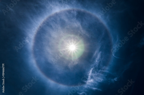 sun halo occurring due to ice crystals in atmosphere