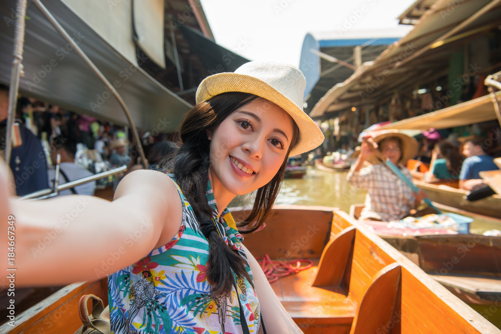 Fototapeta premium happy girl tourist taking self-portrait photo