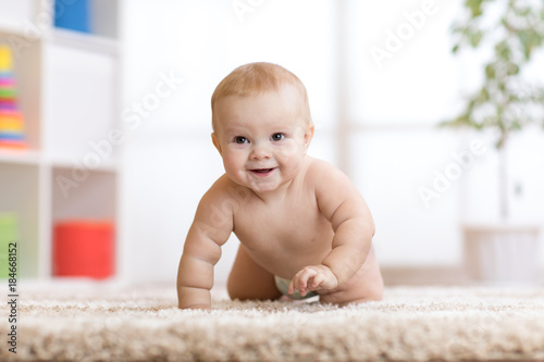 adorable baby crawling on f...