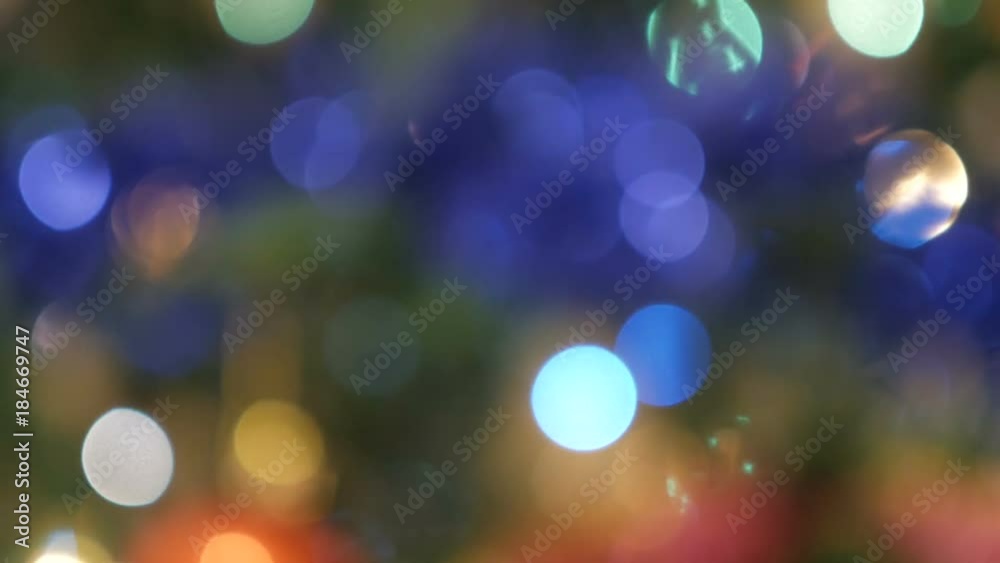 Christmas Balls on Christmas Tree. Christmas and New Year Decoration. Abstract Blurred Bokeh Holiday Background. Blinking Garland. Christmas Balls on Christmas Tree. Christmas and New Year Decoration. Abstract Blurred Bokeh Holiday Background. Blinking Garland.