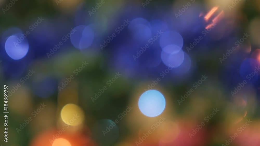Christmas Balls on Christmas Tree. Christmas and New Year Decoration. Abstract Blurred Bokeh Holiday Background. Blinking Garland. Christmas Balls on Christmas Tree. Christmas and New Year Decoration. Abstract Blurred Bokeh Holiday Background. Blinking Garland.