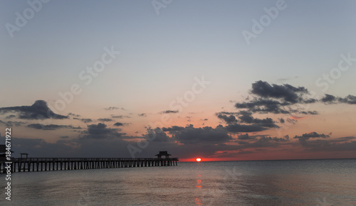 pier jetty at sunset in Naples, forida, usa photo