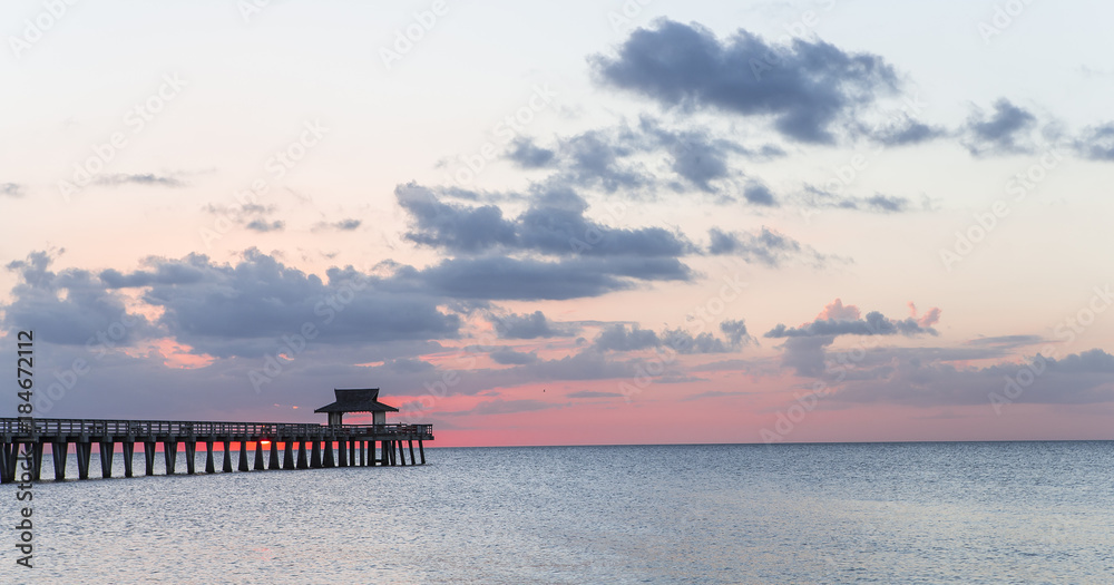 Fototapeta premium pier jetty at sunset in Naples, forida, usa